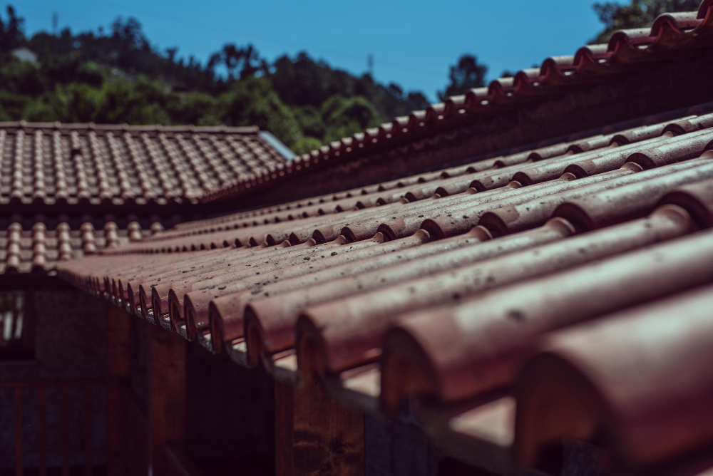 Seamless gutters directing rainwater away from a home's roof and foundation to prevent water damage